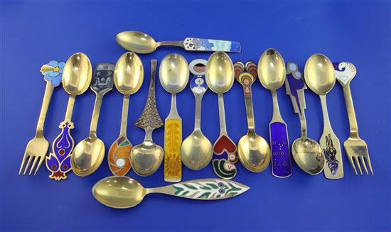 Thirteen Danish sterling silver gilt and enamel Christmas spoons and two forks, all designed by Anton Michelsen, gross 22.5 oz.